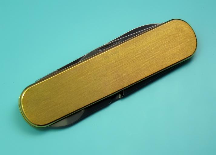 A 74mm gold plated Victorinox Ambassador with satin finish and no key-ring (0.6500.80).