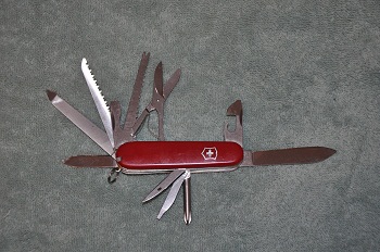 Craftsman from  around 1986.  NOTE: 1. no pliers  2. fish scaler  3. bottle opener locks at 90 degrees  4. phillips screwdriver with can key 5. hole in awl  6. newer bottom fine screwdriver  This knife is very rare variation, possibly made only 1 year due to 1987 introduction of Craftsman with pliers.