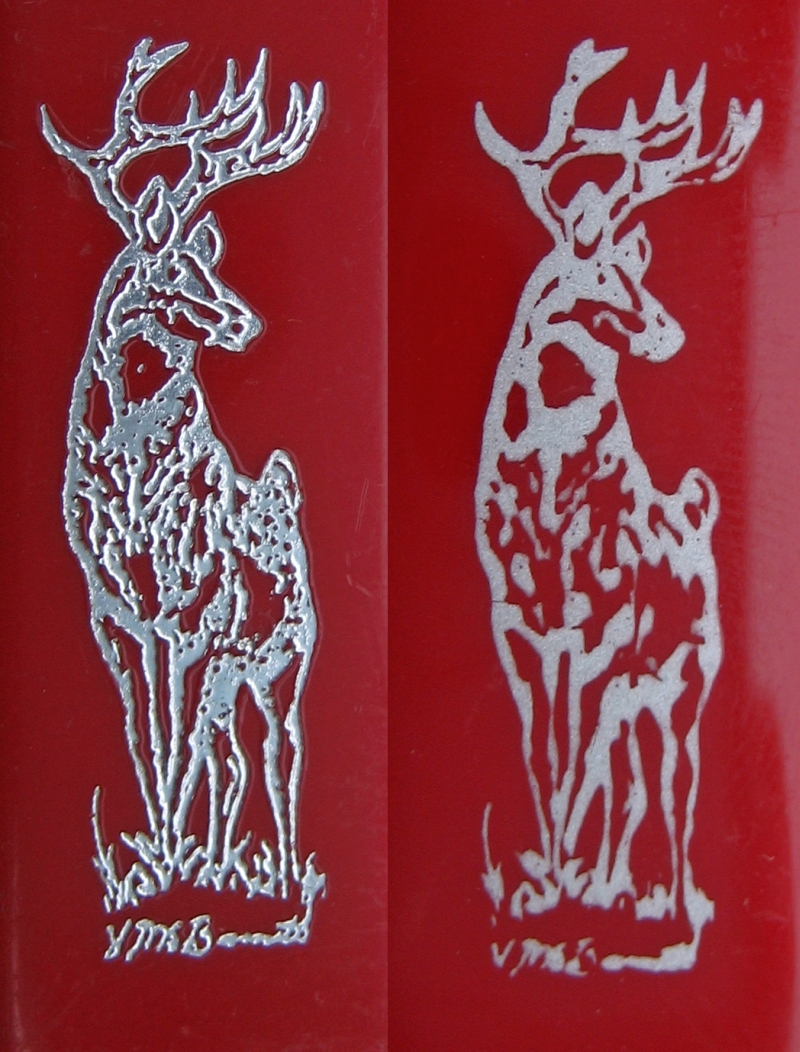 Deer imprint. Older model on the left, newer on the right.