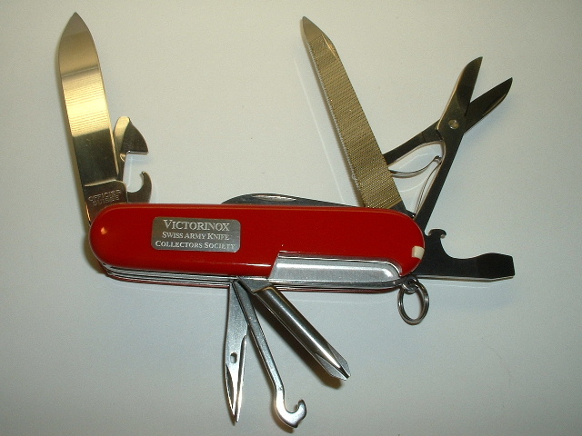 This is the Victorinox Swiss Army Knives Collectors Society (VSAKCS) 2006 club knife. 
It is a custom model called an 'Astronaut', which has an inlaid metal space shuttle on the front scale, and on the reverse a plate engraved with the VSAKCS words spelt out. 
This model is not to be confused with the older 1980's Space Shuttle or Astronaut models, which were completely different, regular, Victorinox releases.