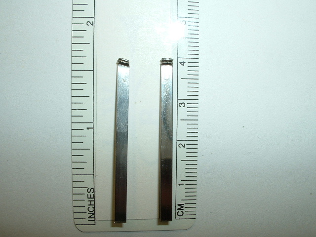 Comparison shot of the 2 Wenger sizes of tweezers. The one with the angular head fits the larger size 85mm knives while the smaller one fits any of the smaller size knives.